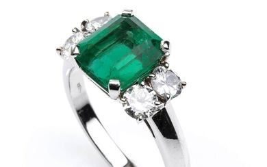 Gold, emerald and diamonds ring 18k white gold. Deep green rectangular cut Colombian emerald ca....