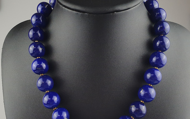 Impressive lapis lazuli necklace with 18K gold clasp and diamond trim.