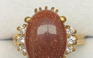 Large Goldstone Gemstone Ring Surrounded by Austrian Crystals on an 18KTGP Band