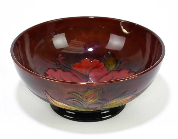MOORCROFT; a 'Hibiscus' pattern flambe bowl, impressed marks and painted...