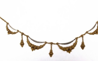 NECKLACE NECKLACE in 18K yellow gold retaining a decoration of sheaves of flowers. Length : 39 cm. Gross weight : 9.69 gr. A gold necklace.
