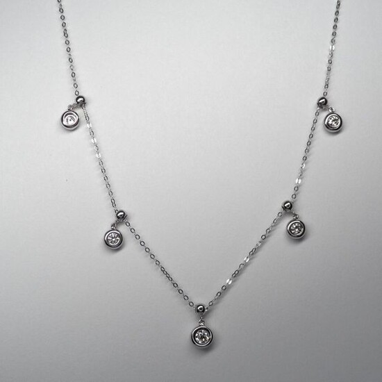 Necklace " Draperie " in white gold, 750 MM, punctuated with five brilliant-cut diamonds in setting, total 0.50 carat, spring ring clasp, chain length 44 cm, weight: 2.75gr. rough.