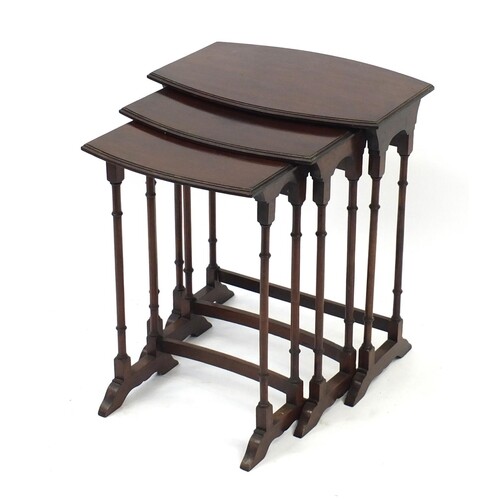 Nest of three mahogany bow front occasional tables with simu...