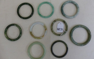 Nine bracelets made of jade and hard stones. Chinese work. Diameter: from +/-7.4cm to 9cm.