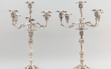 PAIR OF FIVE-LIGHT SILVER PLATED CANDELABRA Apparently unmarked. Decorated with naturalistic leaf tips. On ebonized and molded wood...