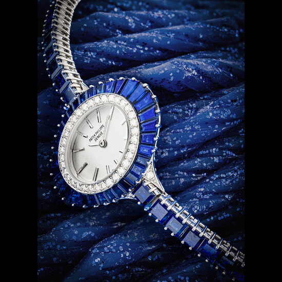 PATEK PHILIPPE. A LADY’S POSSIBLY UNIQUE AND ELEGANT 18K WHITE GOLD, DIAMOND AND SAPPHIRE-SET BRACELET WATCH REF. 4020/1, MANUFACTURED IN 1973