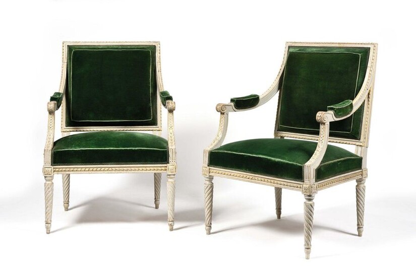 Pair of painted and gilded beechwood armchairs with rectangular back, with a frieze of ribboned rush and piastres, resting on spiral fluted legs. Louis XVI period. H: 95 cm, W: 63 cm