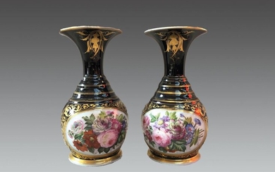 Pair of porcelain baluster vases decorated with bouquets in storerooms on a Sèvres blue background.