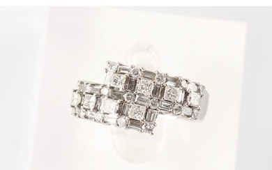 Property of a lady - an 18ct white gold diamond crossover ri...