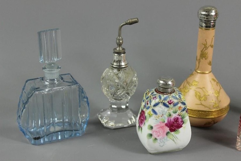 Seven vintage perfume bottles and atomizers, including a sil...