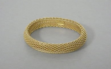 TIFFANY & CO. Bracelet in braided yellow gold...