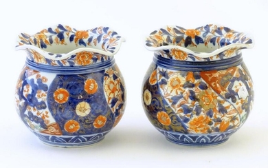 Two Oriental vases of bulbous form with flared rims