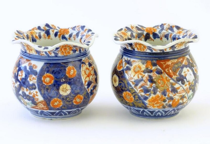 Two Oriental vases of bulbous form with flared rims