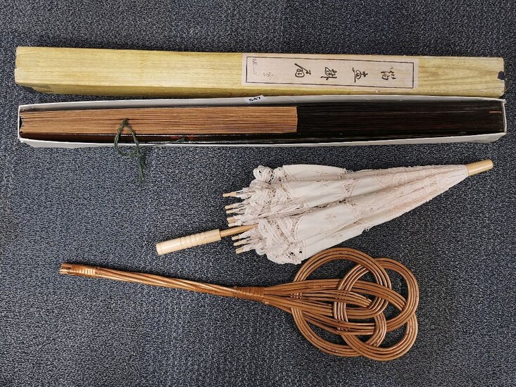 Two large Chinese handpainted fans, L. 89cm, together with a parasol and carpet beater.