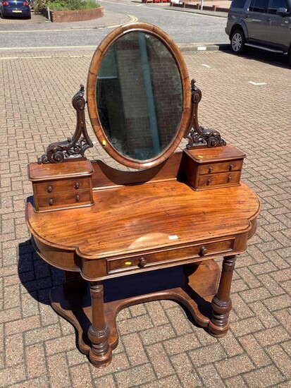 Victorian mahogany dressing table with raised mirror back and drawers below on turned front legs joined by shaped stretcher, 121cm wide x 58cm deep