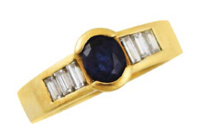 Yellow gold ring with oval sapphire and baguettes...