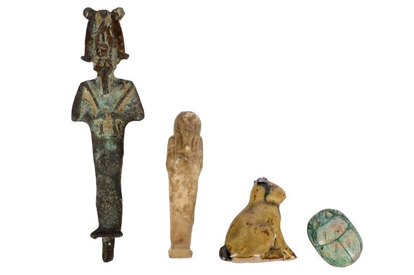 A small Egyptian bronze figure of Osiris, of long...