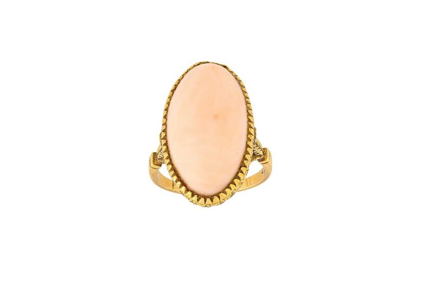 A coral ring, circa 1955 The oval cabochon pink...