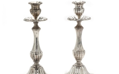 A pair of German silver candlesticks. Swedish import marks. 20th century. Filled. H. 25 cm. (2)