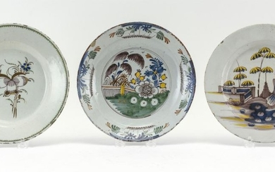 THREE EARLY PIECES OF DELFT A polychrome bowl, a plate with central flower, and a plate with figural scene. Diameters 9".