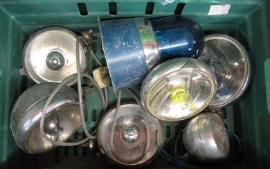 Crate of chromed spot, fog and hand lamps together with a blue rotating emergency services light