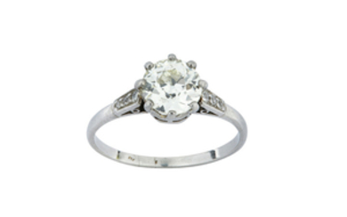 A diamond single-stone ring Set with an old...