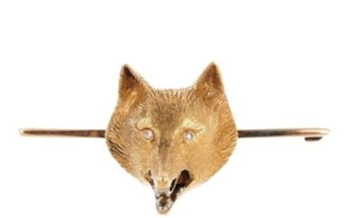 An early 20th century 15ct gold fox head brooch. The