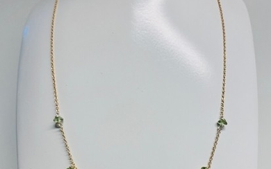 Lærke Trolle: Necklace of gilded sterling silver mounted with green peridot. Adjustable lengths. L. 41–42 cm.