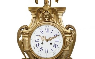 A Louis XVI style gilt bronze cartel clock