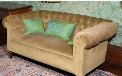 A mahogany and button upholstered sofa
