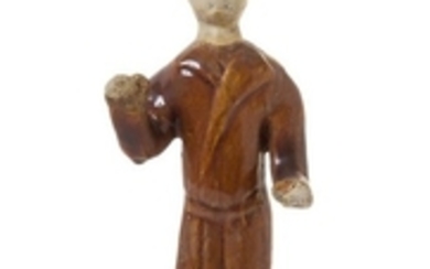 * A Pottery Figure of a Man