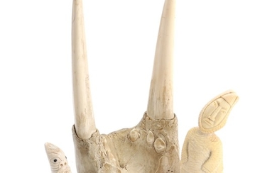 Two Greenlandic antler and walrus tusk tupilak figures and a walrus upper jaw, Odobenus Rosmarus. H. 8–25 cm. (3)