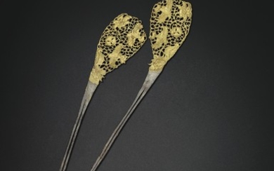A RARE PAIR OF PARCEL-GILT SILVER HAIRPINS, TANG DYNASTY (AD 618-907)