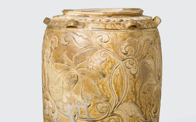 A cream glazed storage jar with brown inlay floral decoration