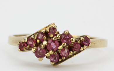 9CT AND RUBY THREE-ROW RING.