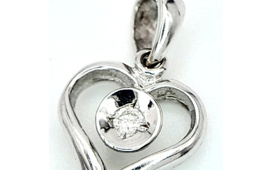 A 18ct White Gold Diamond Heart Pendant, 0.02ct diamond, 0.7...