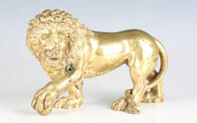 A 19th century Continental cast ormolu model of a Medici lion, height 14.5cm, length 23cm.