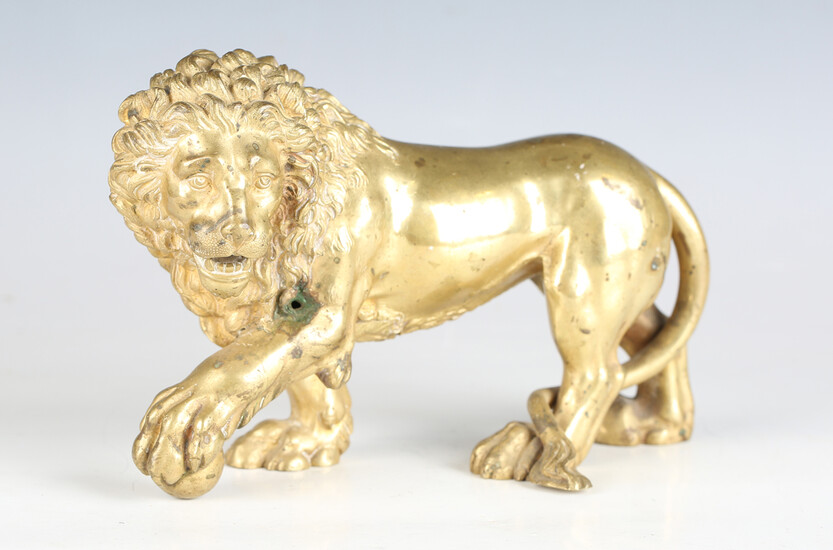 A 19th century Continental cast ormolu model of a Medici lion, height 14.5cm, length 23cm.