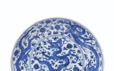 A BLUE AND WHITE 'DRAGON' DISH, ZHENGDE FOUR-CHARACTER MARK IN UNDERGLAZE BLUE WITHIN A DOUBLE CIRCLE AND OF THE PERIOD (1506-1521)