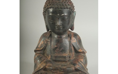 A CHINESE BRONZE SEATED BUDDHA, with traces of gilt, 22cm hi...