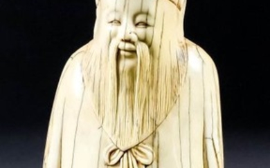 A Chinese Carved Ivory Standing Figure of a Bearded...