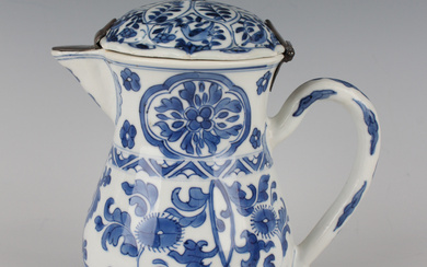 A Chinese blue and white export porcelain jug, Kangxi period, with matched metal mounted cover, the