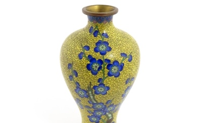 A Chinese cloisonne vase with a yellow ground decorated with...