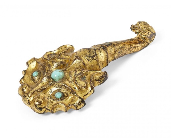 A Chinese gilt bronze belt hook, Han dynasty, finely cast...