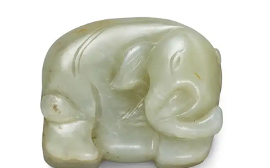 A Chinese green and russet jade elephant Late Qing dynasty The standing...