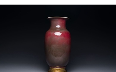 A Chinese monochrome copper-red-glazed vase with gilt bronze...