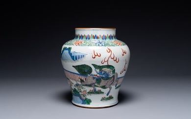 A Chinese wucai 'qilin' baluster vase, 19th C.