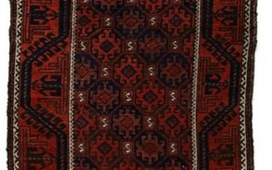 A FINE AND NOTABLE ANTIQUE BALOUCH ORIENTAL RUG