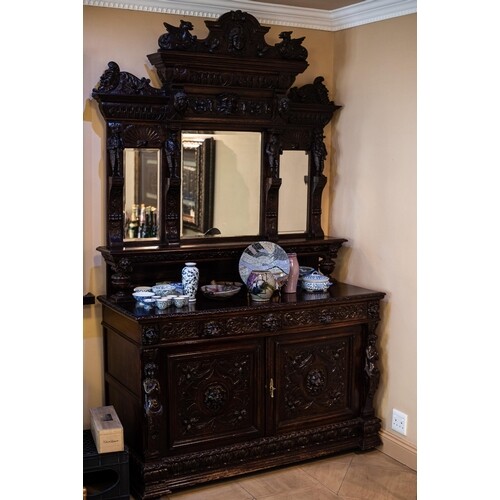 A FLEMISH OAK SIDEBOARD In two parts, the upper gallery com...