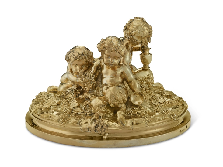 A FRENCH SILVER-GILT FIGURAL GROUP OF THREE PUTTI MARK OF ANDRE AUCOC, PARIS, CIRCA 1900